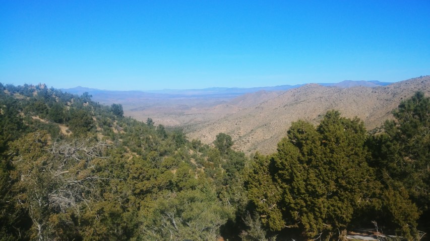 A sweeping vista with blue mountains in the distance..