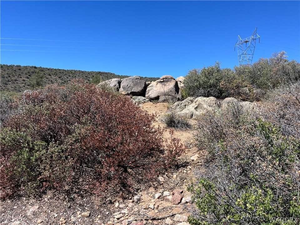 36.6 acres in Kingman in Kingman: More boulders, and looking west toward transmissio