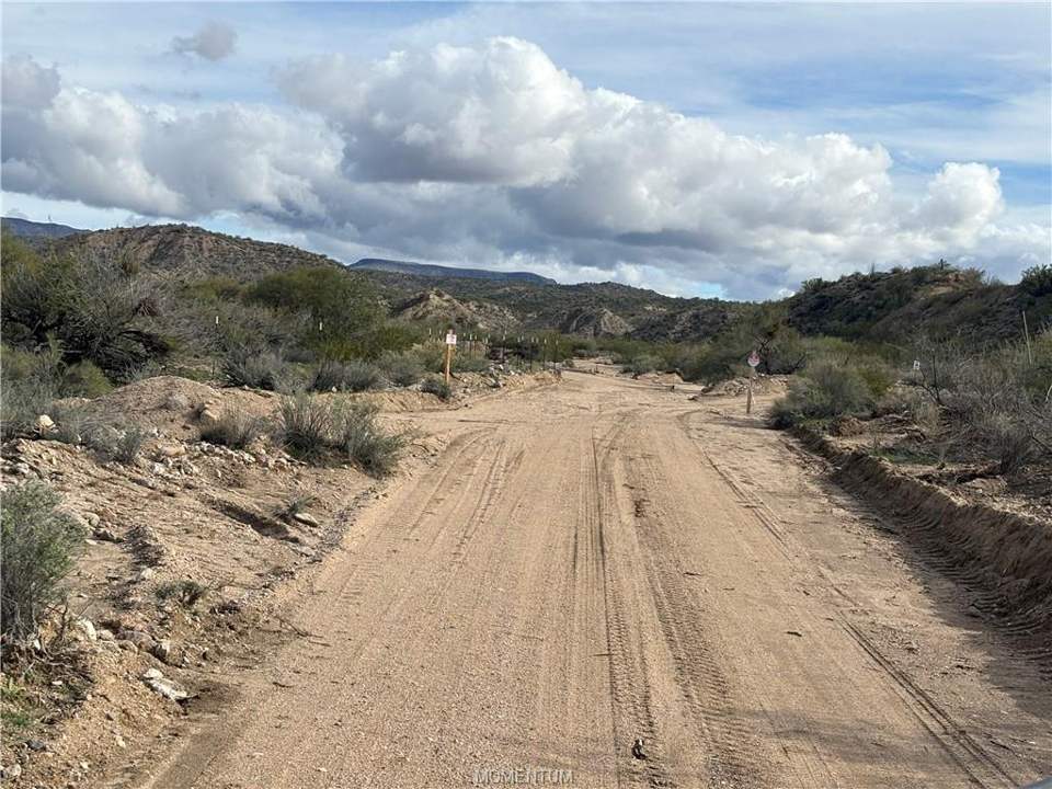 119.91 acres in Kingman in Kingman: View of dirt / gravel road with a mountain view an