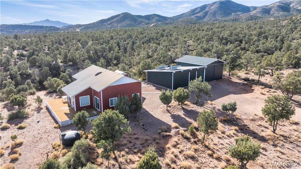2 bed, 1 bath home on 40.96 acres in Kingman: View from above of property featuring mountains an