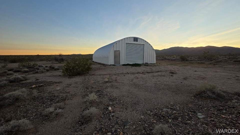 4.01 acres in Meadview in Meadview: View of outdoor structure at dusk