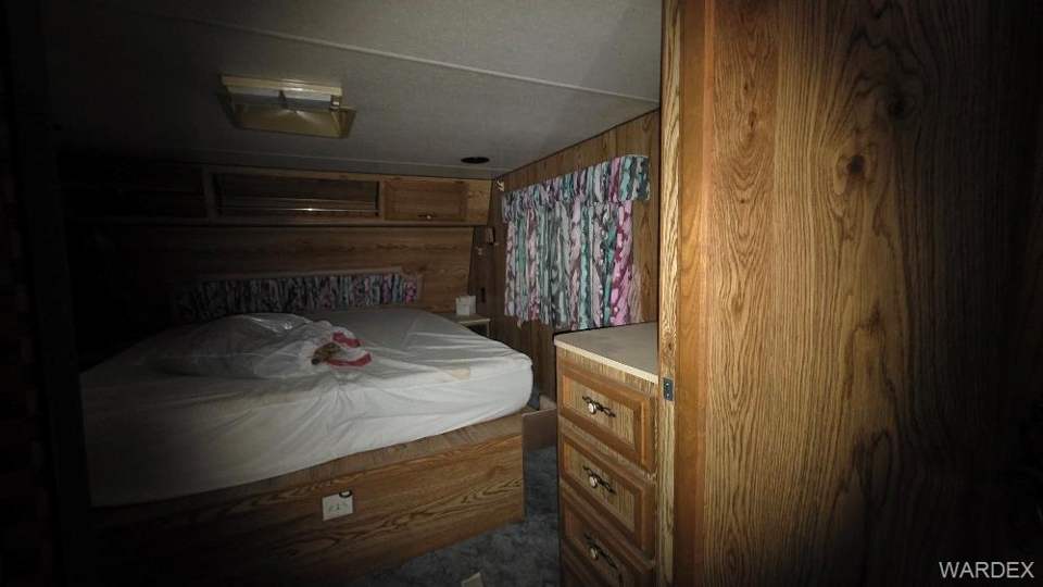4.01 acres in Meadview in Meadview: Bedroom with wood walls