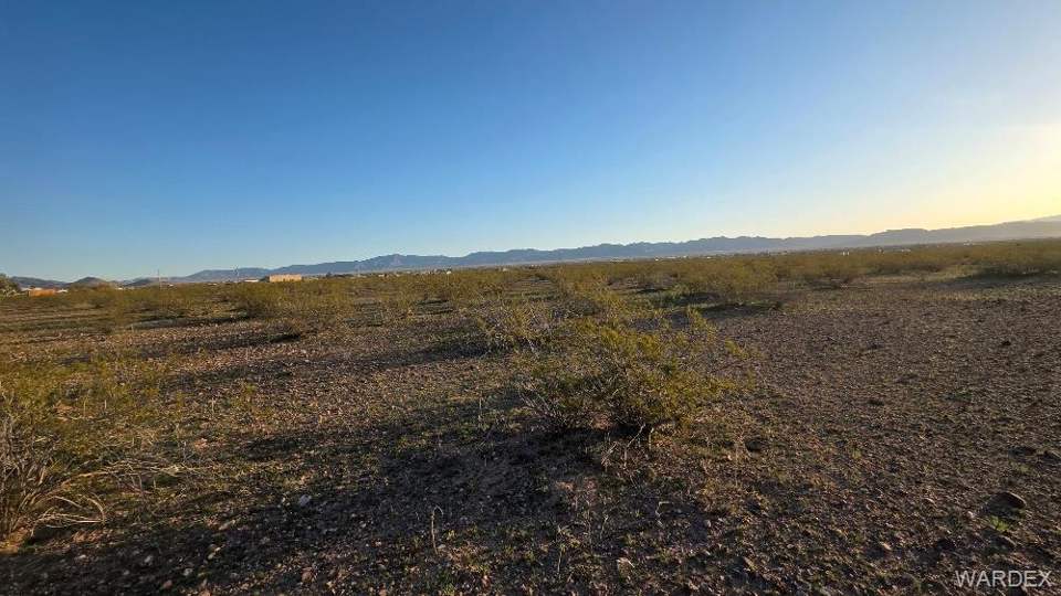 9.99 acres in Golden Valley in Golden Valley: View of yard with a mountain view and a view of ru