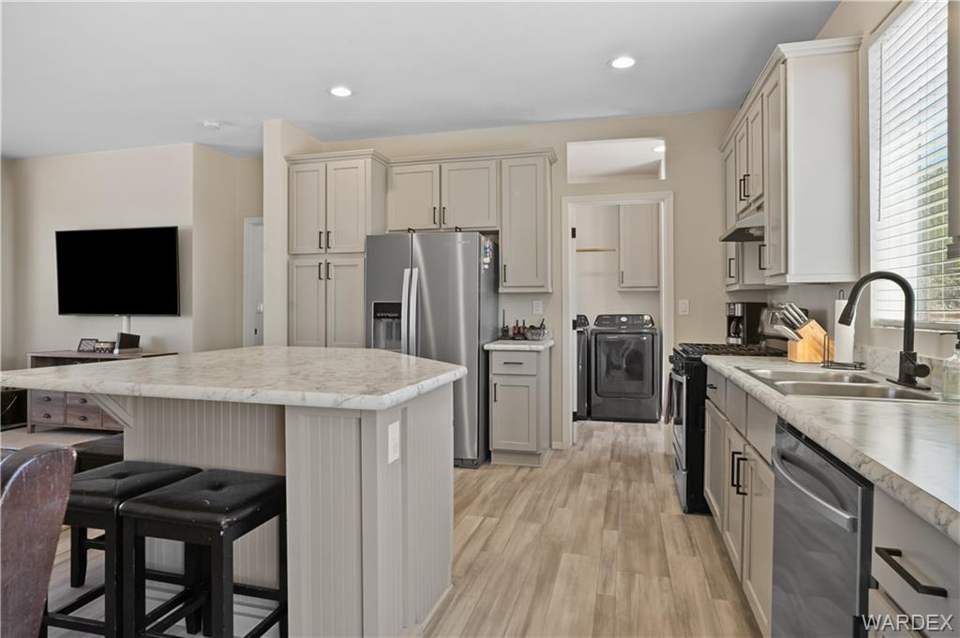 3 bed, 2 bath home in Kingman in Kingman: Kitchen featuring a breakfast bar area, light coun