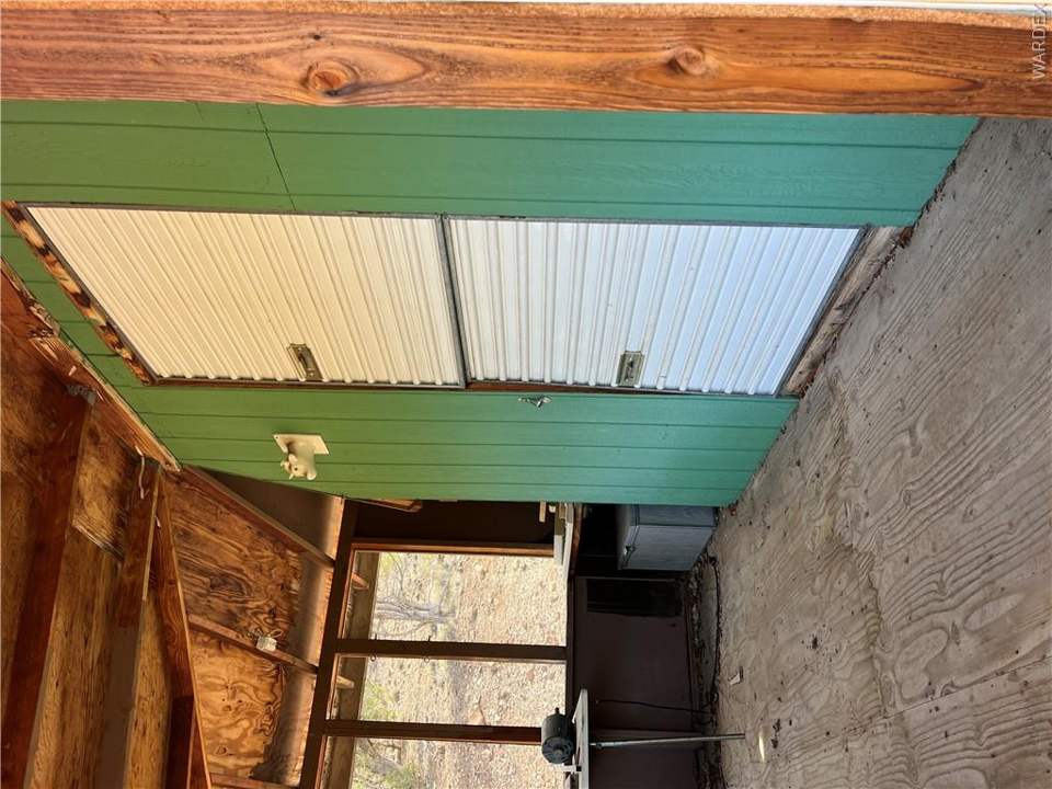 36.3 acres in Kingman in Kingman: Front of storage shed with covered porch.