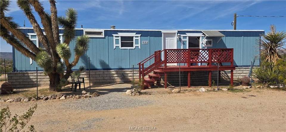 2 bed, 1 bath home on 1.18 acres in Golden Valley: View of front of home featuring a wooden deck and