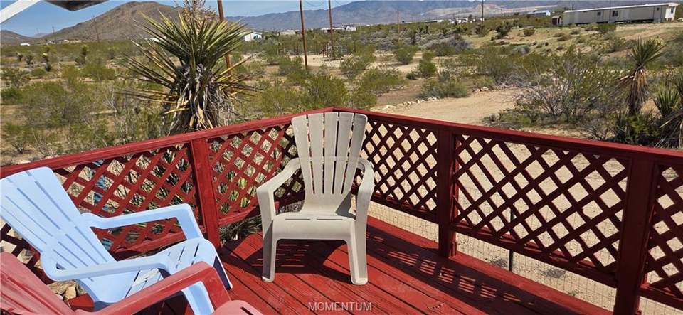 2 bed, 1 bath home on 1.18 acres in Golden Valley: Deck with a mountain view