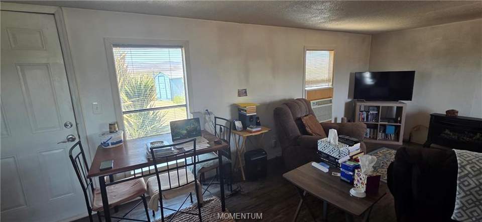 2 bed, 1 bath home on 1.18 acres in Golden Valley: Office area with dark wood finished floors, a text