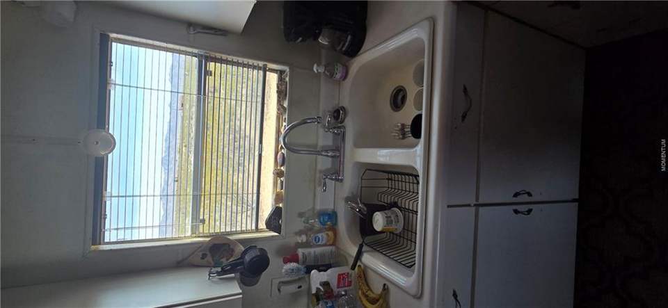 2 bed, 1 bath home on 1.18 acres in Golden Valley: Kitchen with light countertops and white cabinetry