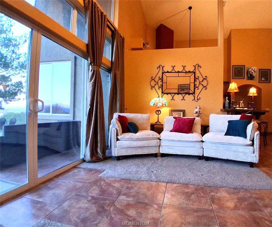 3 bed, 2 bath home on 7.66 acres in Kingman: Small entertainment groupings give the spacious li