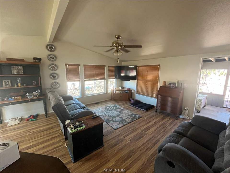 2 bed, 2 bath home on 2 acres in Golden Valley: Vaulted Ceiling and Large Windows Brighten the Liv