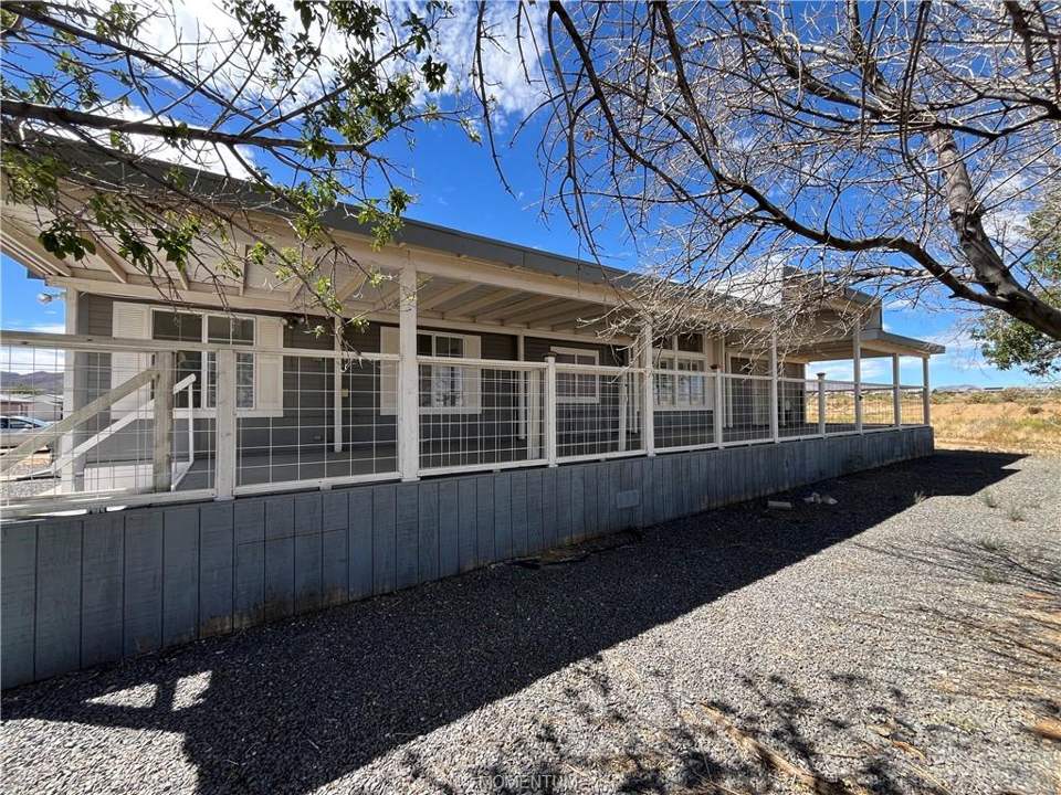 2 bed, 2 bath home in Kingman in Kingman: Front of home with expansive covered porch that's