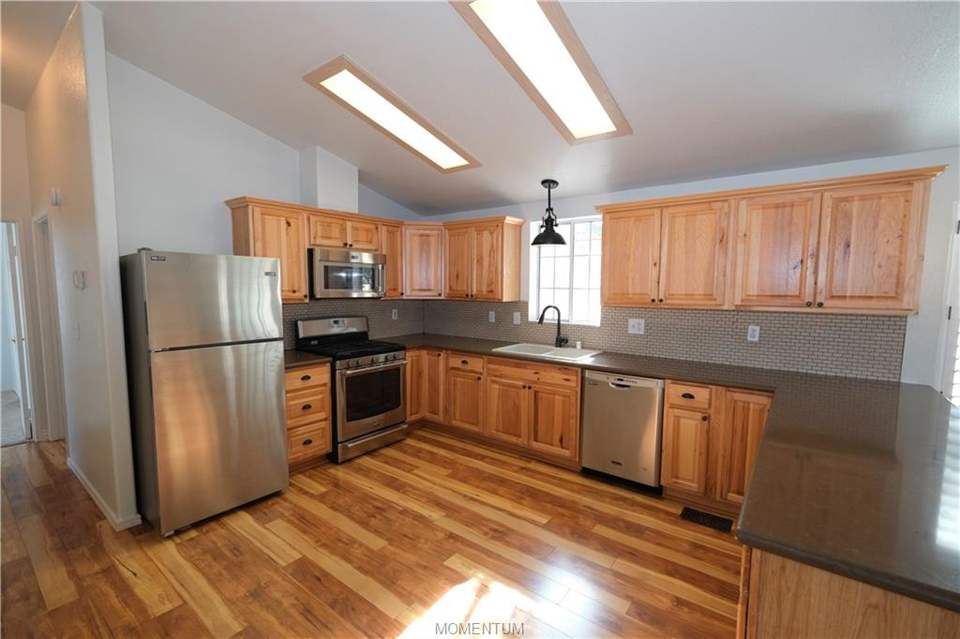2 bed, 2 bath home in Kingman in Kingman: Kitchen with hickory cabinets, stainless steel May