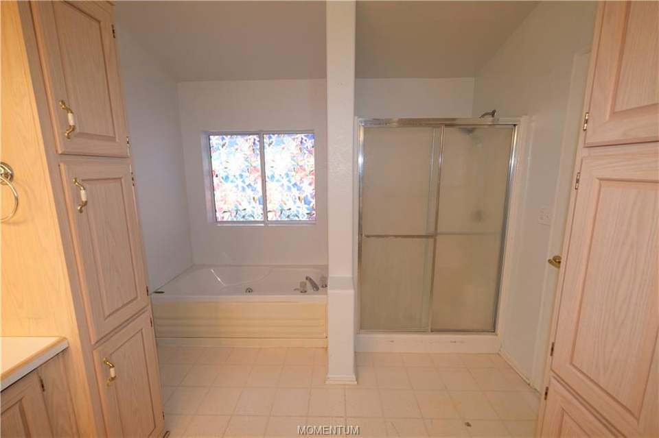 2 bed, 2 bath home in Kingman in Kingman: Primary bathroom contains garden tub, shower, larg