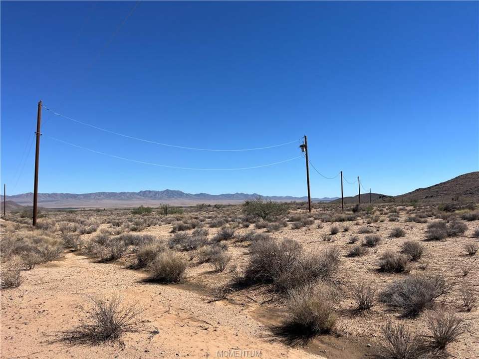 10.03 acres in Kingman in Kingman: Showing power to east side of parcels.
