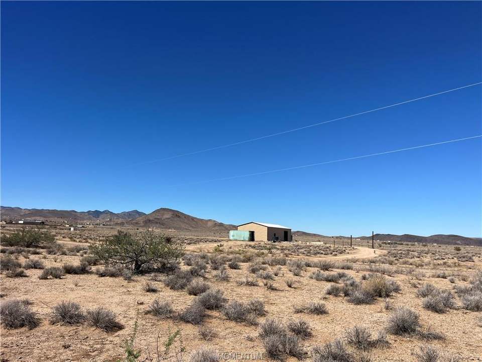 5 acres in Kingman in Kingman: From center of property, looking north. Garage is