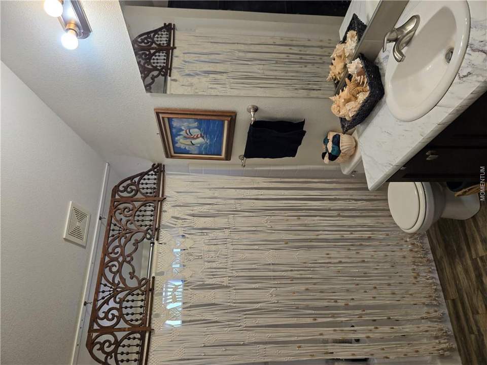 1 bed, 1 bath home on 39.4 acres in Seligman: Bathroom featuring a vanity with an integrated sin